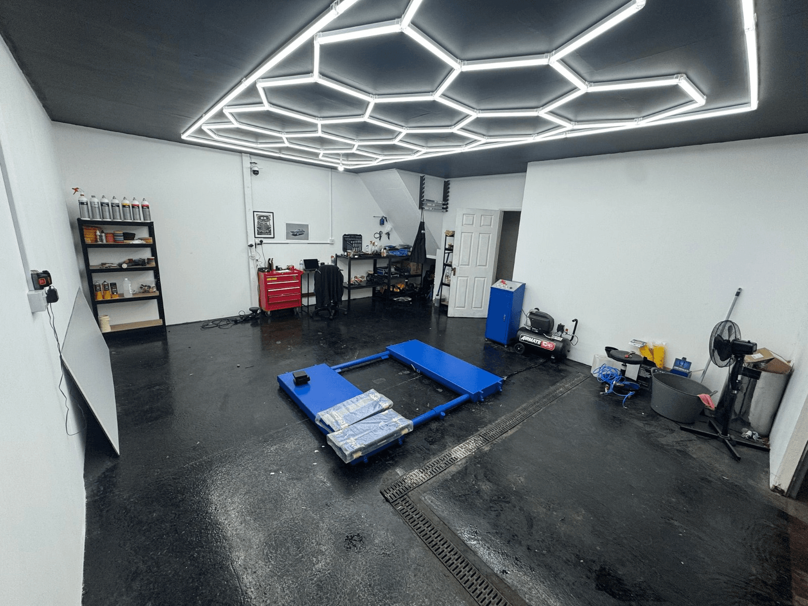 Vehicle on lift inside the garage workshop